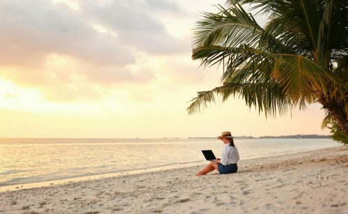 Working,Remotely,On,Seashore.,Young,Successful,Woman,Female,Freelancer,In